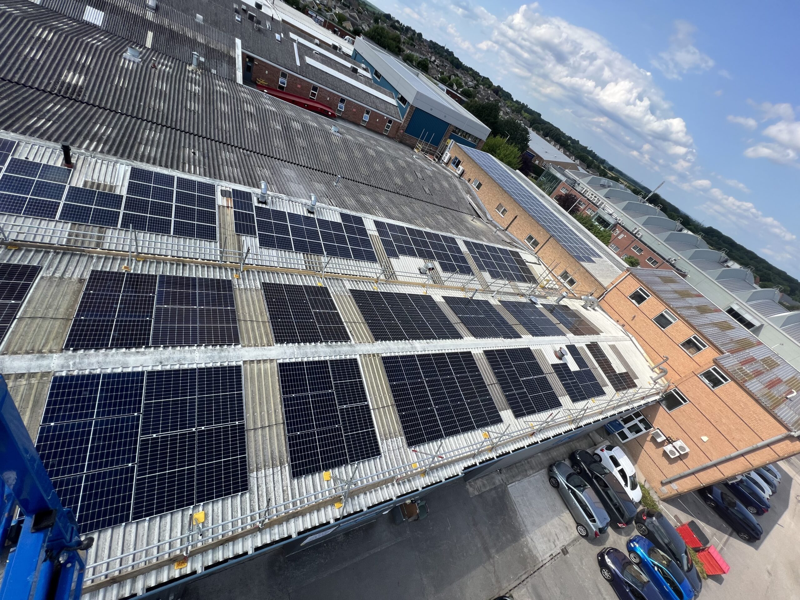 Commercial building solar panel installation on a metal roof to enhance energy efficiency and sustainability.