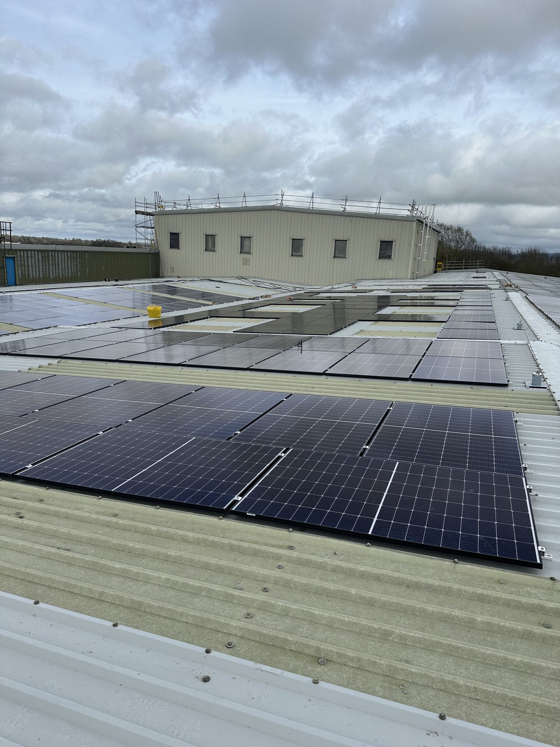 Commercial metal roof solar panel installation for industrial renewable energy solutions and efficiency optimization