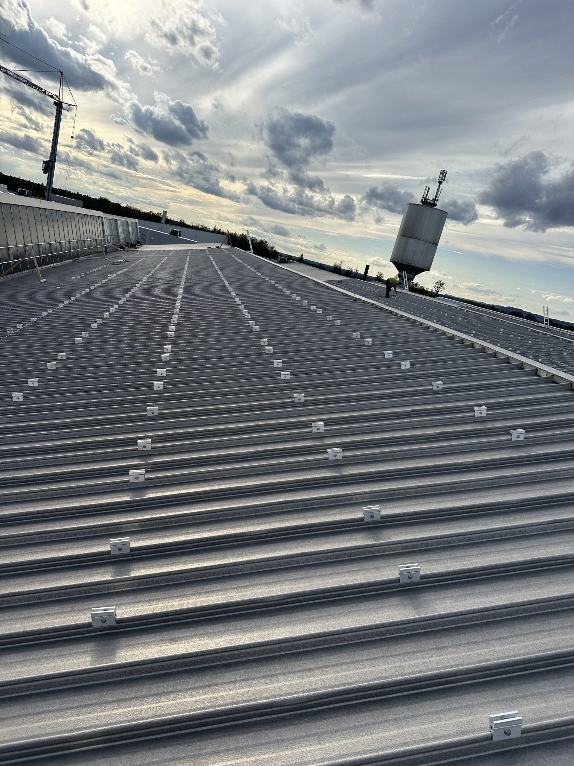 Metal rooftop solar mounting system prepared for photovoltaic panel installation on an industrial building